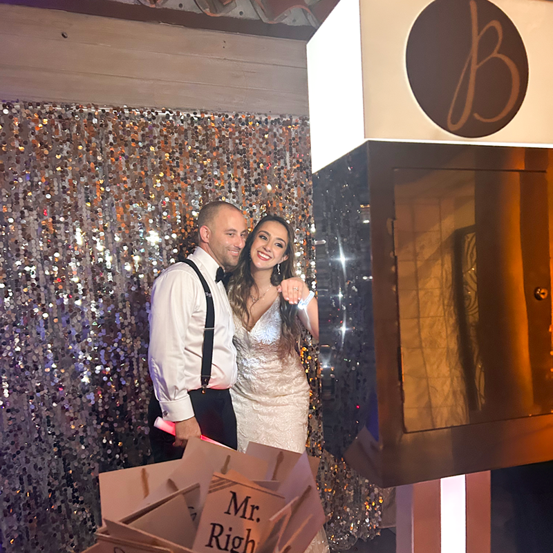 Bride and Groom taking photo with Platinum Photo Booth at the Coral Gables Country Club